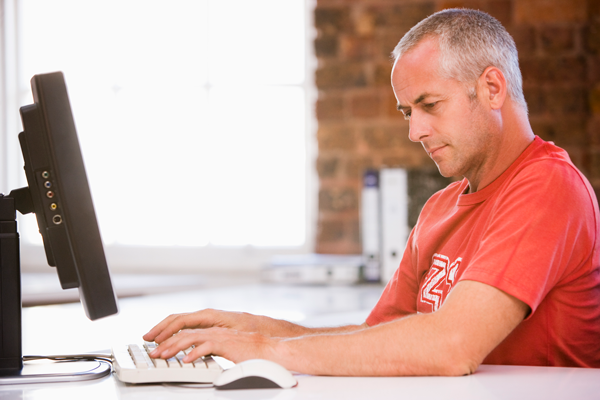 h-man-working-on-computer-600x400.png