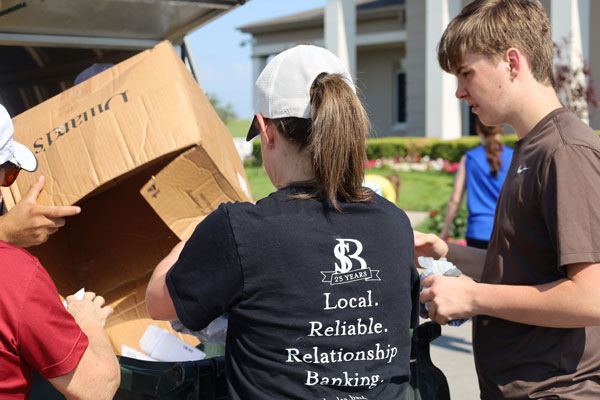 Bank employees volunteering with children
