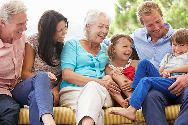 Smiling family on a couch