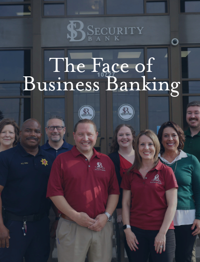 Faces of Security Bankers standing on front steps