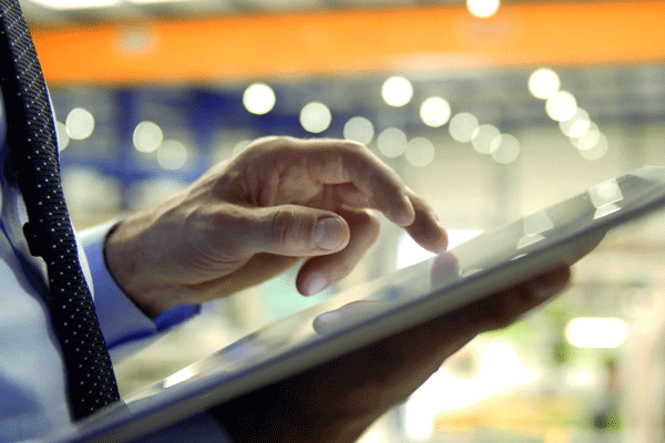 Hands on a tablet