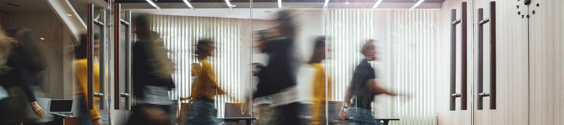 business lobby with people entering and exiting